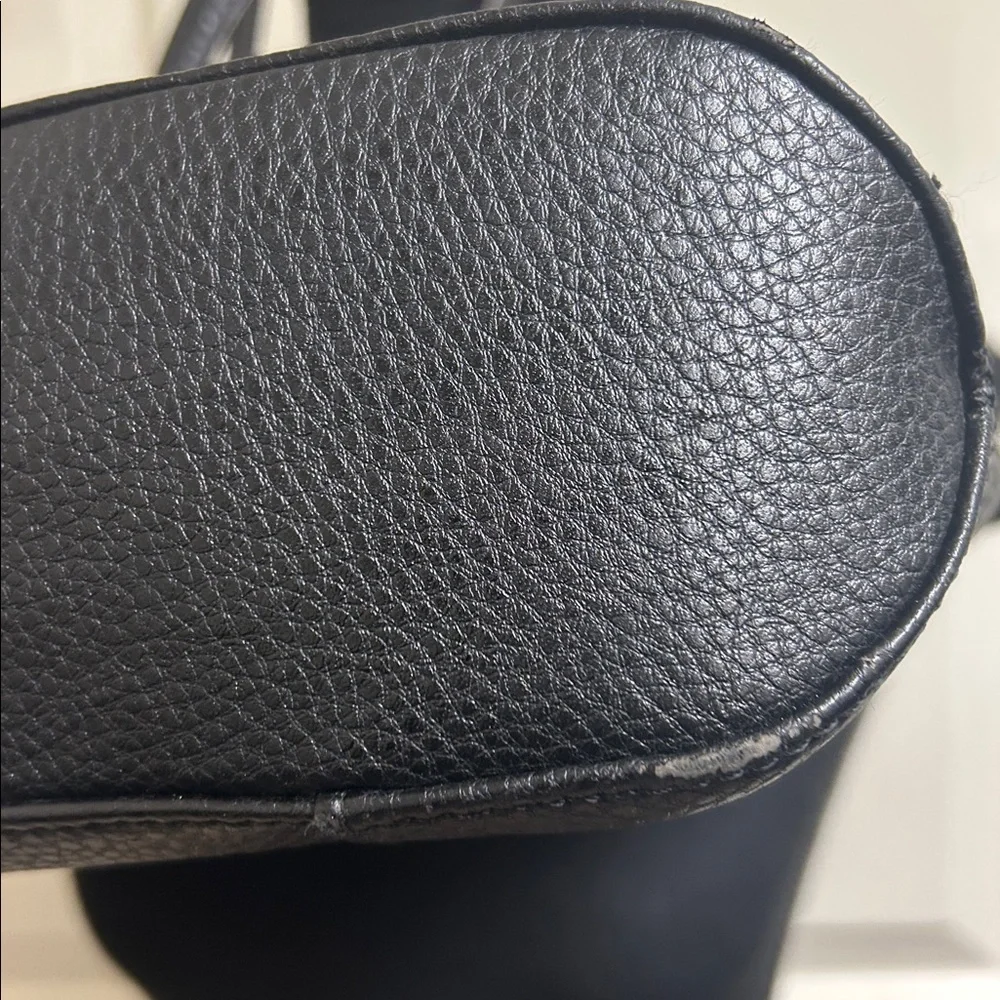 Anne Klein Black leather Tote with size pocket and adjustable straps. 13”x9 1/2”